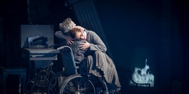Cinderella (Cordelia Braithwaite) hugging Robert, her father (Alan Vincent) in Matthew Bourne's Cinderella