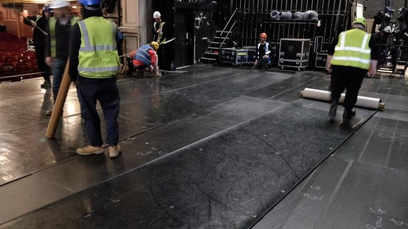 Laying the dance matting on the stage